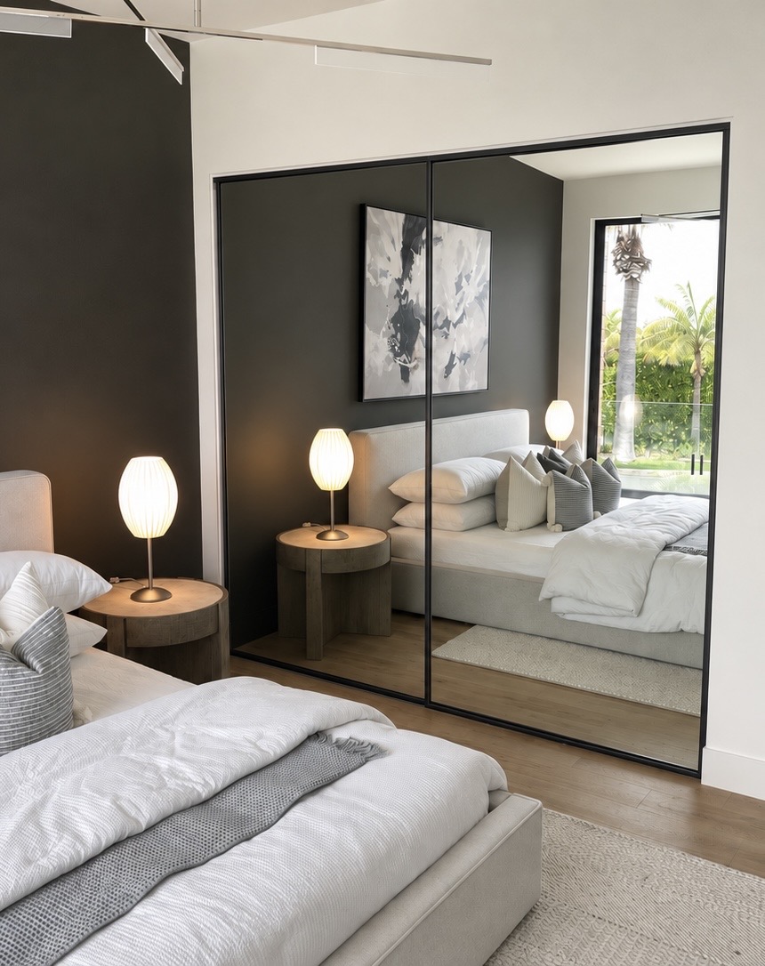 Mirrored sliding closet doors in a bedroom